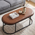 Oval Faux Leather Coffee Table, Black Metal Base